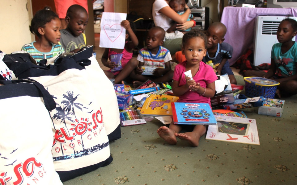 children playing with books and toys